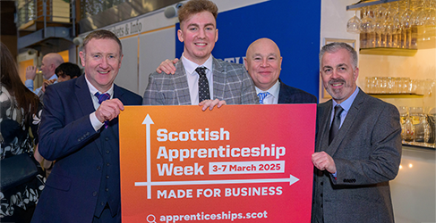 Cameron Clark Scottish Apprenticeship Week 2025 Scottish Water apprentice Cameron Clark with a group holding a sign promoting Scottish Apprenticeship Week 2025